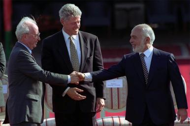 Isaeli Prime Minister Yitzhak Rabin shakes hands with Jordanian King Hussein in front of U.S. President Bill Clinton at the White House in 1994.